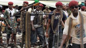 former Niger-Delta militants surrendering their weapons to the government.