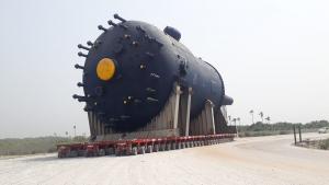 a mammoth storage tanker is transported to the Dangote Refinery site.  